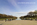 Iconic view of the tourist crowds on the western plaza of the Reflecting Pool with the Washington Monument in the distance, National Mall, Washington DC