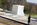 View of the white marble sarcophagus (Tomb of the Unknown Soldier) placed above the grave of the Unknown Soldier from World War I, with three crypts to the west for the Unknowns of World War II, Korean & Vietnam, Arlington National Cemetery