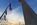 Dayset image of America's national monument encircled by some of the fifty American flagpoles, The Mall, District of Columbia