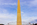 Beautiful evening view of the sun shining on the surface of the Washington Monument encircled by fifty America flagpoles, The Mall, DC