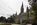 A summertime view of the imposing Gothic Revival and Romanesque edifice of Healy Hall featuring the John Carroll Statue fronting the iconic buidling, Georgetown, Washington DC