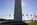 View of the bottom-half of the Washington Monument encircled by 50 American flagpoles, Washington DC
