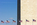 Telephoto lens view of the bottom-half of the Washington Monument including American flagpoles encircling the national monument of America, District of Columbia