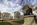 Springtime scene from the Capitol grounds featuring the Dr. Hunter Holmes McGuire Statue including the Palladian edifice of the Virginia State Capitol, Capitol District, Richmond, Virginia