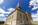 Outdoor photograh featuring the Classical Revival edifice of the George Washington Masonic National Memorial building including the prominent tower fashioned on the Ancient Lighthouse of Alexandria, Egypt