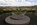 Unique scene from the memorial grounds of the George Washington Masonic National Memorial featuring the hardscaped Freemason square and compasses emblem and the town of Alexandria, Virginia