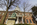 State House grounds scene featuring the former Roger Brooke Taney Statue fronting the Georgian style facade of the Maryland State House, State Circle, Annapolis