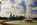 Top of the Rocky Steps summertime scene featuring the tree-lined avenue of the Benjamin Franklin Parkway and the Philadelphia skyline