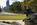 Eakins Oval summertime scene featuring a view along the ceremonial tree-lined avenue of the Benjamin Franklin Parkway including City Hall and the Center City skyscrapers of Philadelphia in the distance