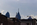 Philadelphia street scene featuring the tops and spires of the Center City skyscrapers including Liberty One, Liberty Two and the William Penn Statue crowning the clock tower of City Hall