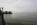 Banks of the Hudson River scene featuring a view of Liberty Island and the Statue of Liberty in the distance, Manhattan, New York City