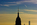 Late-afternoon aerial scene from Midtown, New York City featuring the top and spires of the Empire State Building and the One World Trade Center, Manhattan