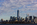 Liberty State Park Hudson River scene featuring Ellis Island in the foreground and the Lower Manhattan skyline in the background including the One World Trade Center, Black Tom Island, New Jersey
