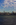 Hudson River portrait scene from Black Tom Island featuring a view of the Midtown Manhattan skyscrapers including the Empire State Building, Liberty State Park, New Jersey