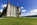 View of the neoclassical and early gothic facade of Plas Newydd country house with the Menai Strait in the background, Llanfairpwllgwyngyll, Anglesey, Gwynedd
