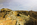 Landscape from the opencast copper mine at Parys Mountain, featuring the Grade II Listed windmill in the distance, Amlwch, Anglesey, Gwynedd