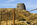 View of the top-section of the Grade II Listed Parys Mountain Windmill from the lunar-like landscape of the opencast copper mine at Amlwch, Anglesey