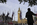 One of the views of Parliament Square featuring the Nelson Mandela Statue, European Flagpoles & Palace of Westminster on Victory in Europe Day, London, England