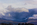 A unique telephoto lens scene featuring a cloudscape and mountainscape scene from the Isle of Anglesey featuring the Snowdonia Mountains, Gwynedd, North Wales
