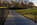 Autumnal scene from the Vietnam Veterans Memorial featuring the two reflective black triangular walls sinking into the earth, Constitution Gardens, Washington DC