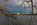 A stunning framed late afternoon scene from the Potomac River Tidal Basin featuring the Thomas Jefferson Memorial, National Mall, Washington DC