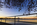 An early morning dawn scene from the Potomac River Tidal Basin, featuring the Jefferson Memorial and cherry blossoms, National Mall, Washington DC