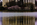 Early morning springtime scene from the Tidal Basin featuring the reflection of the colonnade of the Jefferson Memorial and cherry blossom in bloom, National Mall, Washington DC