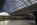 Upper concourse scene from St Pancras International train terminal featuring the formerly known Barlow Trainshed roof and the statue of John Betjeman, London, England