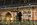 St Pancras International nightography featuring a view of the bronze Meeting Place Statue from the upper concourse of the railway station, London, England