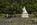 Kensington Gardens springtime scene featuring a view of the statue of a young Queen Victoria fronting the eastern-side of Kensington Palace, Royal London, England
