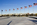 Patriotic view of a small collection of the fifty American flagpoles encircling the base of the Washington Monument, The Mall, Washington DC