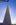 A portrait view from the cicular plaza and base of the Washington Monument, featuring the shadow-side of America's national monument including American flagpoles, The Mall, Washington DC