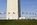 National Monument scene featuring the base and plaza encircled by American flagpoles, Washington Monument, District of Columbia