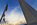 View from the base of the Washington Monument towards sunset including a collection of the fifty American flagpoles encircling it's public plaza, Washington DC