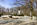 Spring scene from the Roosevelt Memorial Plaza featuring the bronze statue of Teddy Roosevelt and granite monoliths, Theodore Roosevelt Island, George Washington Memorial Parkway, District of Columbia