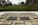 Spring scene from the John F. Kennedy Gravesite, featuring the grave markers, Eternal Flame & Arlington House in the background, Arlington National Cemetery, Virginia
