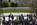 Early morning tourism crowds gathering around the Kennedy gravesite at Arlington National Cemetery, Virginia