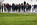 Military cemetery bird's eye view overlooking the Kennedy gravesite at Arlington National Cemetery, featuring the early morning tourism crowds gathering
