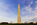 Dayset view of America's national monument, the Washington Monument with fifty American flagpoles encircling it's plaza, The Mall, Washington DC