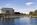 A scene from America's Front Yard featuring a view from the Reflecting Pool promenade looking towards the Abraham Lincoln Memorial including visitor crowds ascending and descending the ceremonial approach up towards the Greek Doric temple, Washington DC