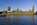 One of the sights of London featuring a view of the iconic Gothic edifice of the Palace of Westminster from across the River Thames on the Thames Path