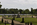Sunken Garden scene featuring a view of the statue of a young Queen Victoria facing out onto Round Pond, The Cradle Walk, Kensington Palace grounds, South Kensington, London, England