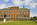 The southern edifice of Kensington Palace fronted by the statue of William III