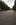Street level portrait scene along the ceremonial tree-lined avenue of the Mall looking towards the Victoria Monument & Buckingham Palace, Royal London, England
