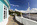 View from beside "The Hotel Portmeirion" & Quayside looking the riverbank of the River Dwyryd including the Portmeirion Bell Tower in the distance, Gwynedd, North Wales