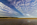 A beautiful late afternoon view from Red Wharf Bay featuring a vibrant beachscape, cloudscape and coastline scene, Area of Outstanding Natural Beauty, Isle of Anglesey, Gwynedd