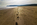 Red Wharf Bay morning beachscape scene featuring footprints and the headland at Llanddona, Isle of Anglesey, North Wales 