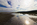 Early morning beachscape, seascape and cloudscape reflection from Red Wharf Bay featuring the emerging sun and headland at Llanddona, Isle of Anglesey, Gwynedd