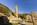 Porth Wen Brickworks site scene featuring the crumbling remains including a chimney and old workhouse, Isle of Anglesey, Gwynedd