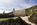 White Bay view nearby to the quay area of the Victorian brickworks at Porth Wen including a view of the crumbling and exposed remains of the accommodation and workshop building, Llanbadrig, Anglesey, North Wales